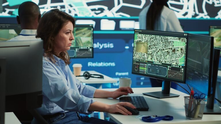 Employee navigating on satellite radar and map to search for routes