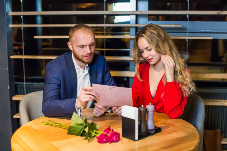 young-couple-reading-menu-table-restaurant